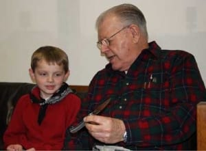 A.G. Russel teaching knife safety to a youth