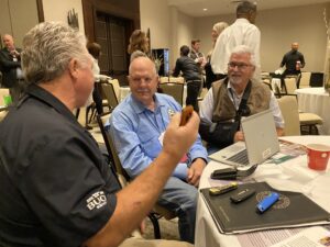 photo CJ Buck at NASC meeting talking to state legislators