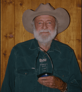 Ed Fowler holding a Blade Award