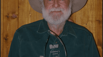 Ed Fowler holding a Blade Award